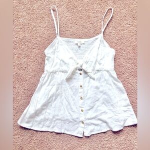 White spaghetti strap babydoll top with tie front, elastic back